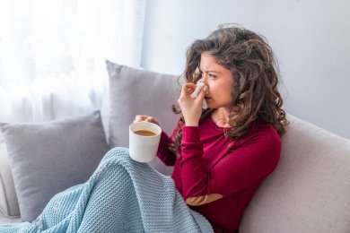 stock-photo-sick-day-at-home-asian-woman-has-runny-and-common-cold-cough-closeup-of-beautiful-young-woman.